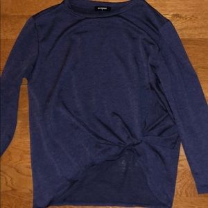 blue sweater like shirt with knot at the bottom